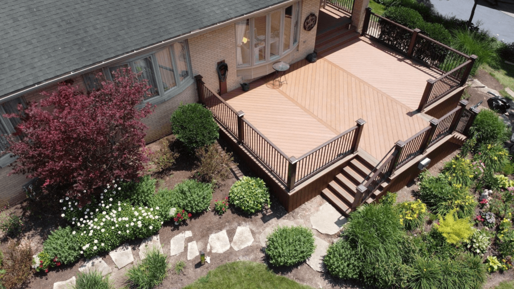 aerial view of composite deck with railing and steps.