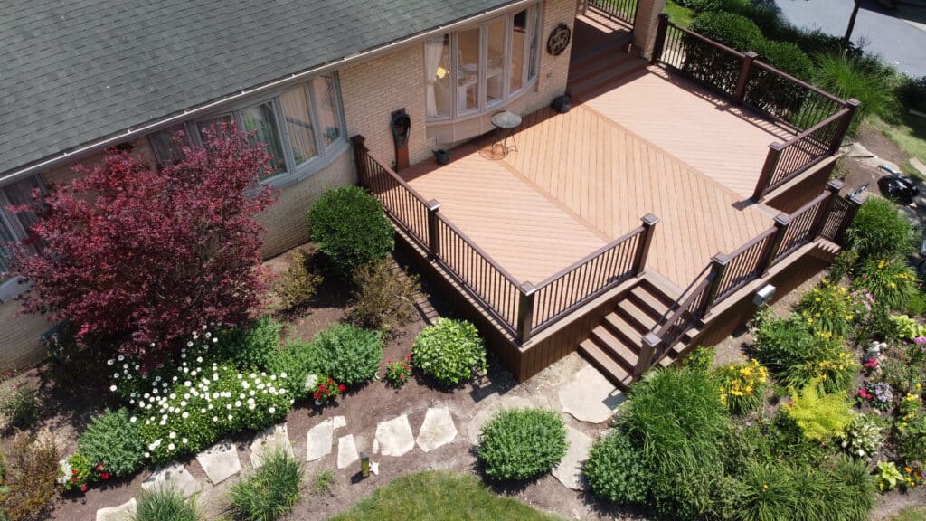 aerial photo of a home with a rectangular deck with boards placed in a diagonal pattern.