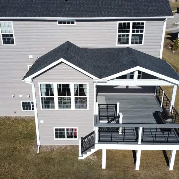 photo of a four-season room with covered composite deck