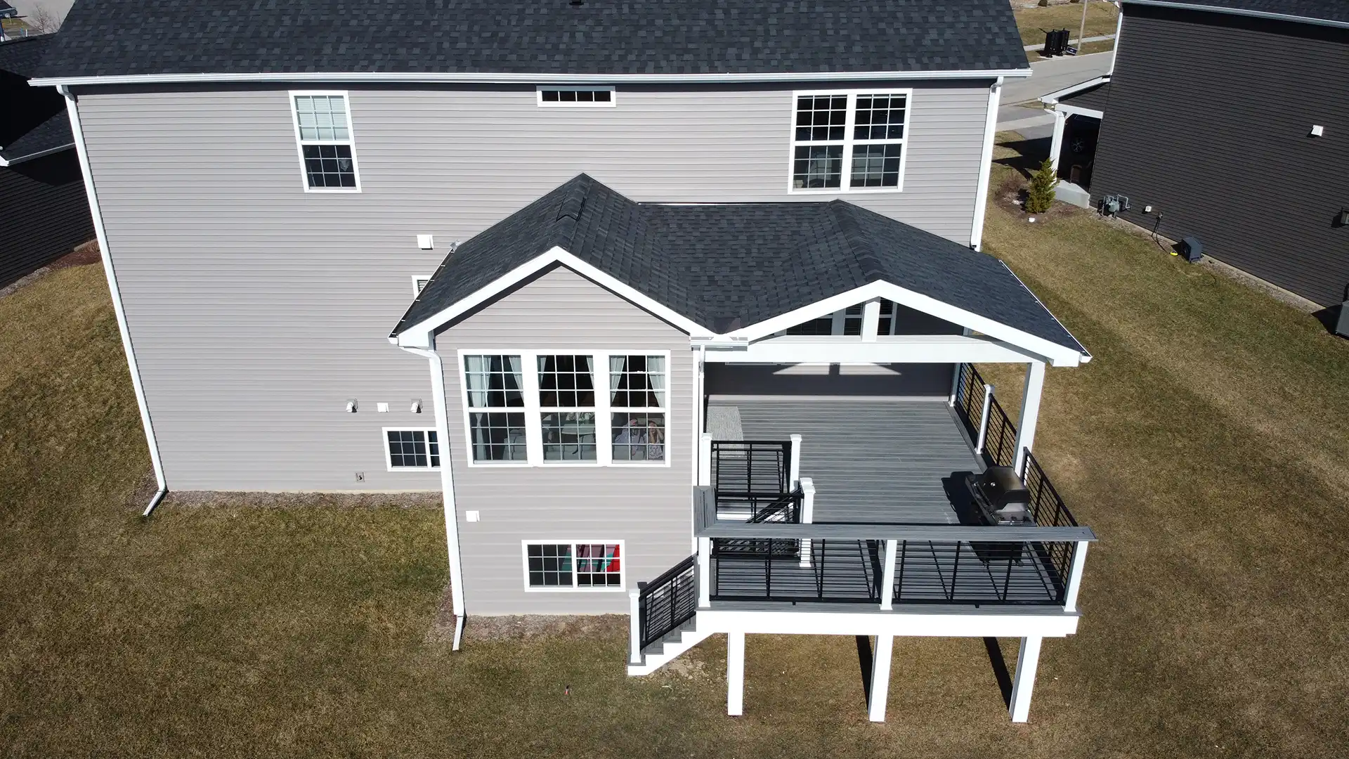 photo of a four-season room with covered composite deck