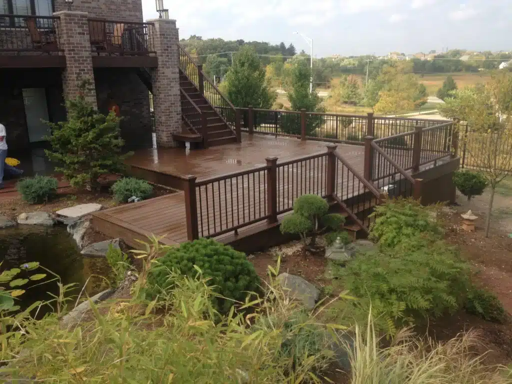 multi-level deck with a pond in the yard - local deck contractors in monee il