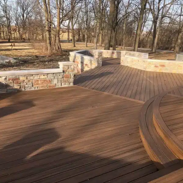 photo of a close-to-ground multi-level deck with angled deck boards and curved deck stairs.