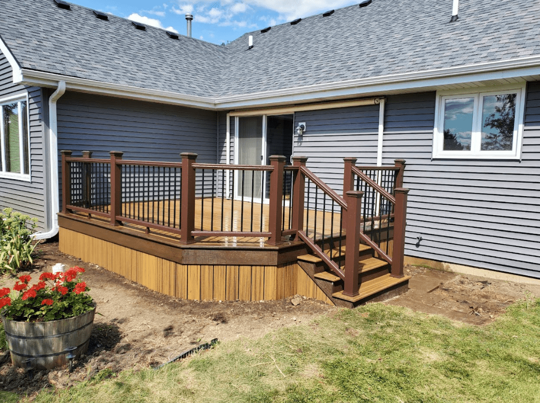 photo of a backyard deck with deck railing and steps