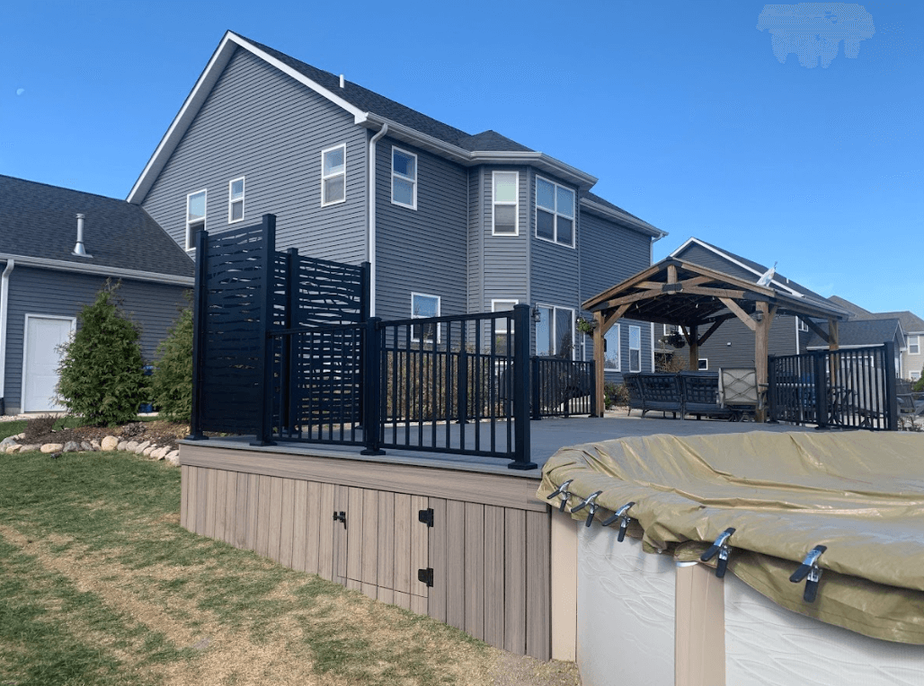 photo of a pool deck with pavilion, privacy screens, and underdeck storage