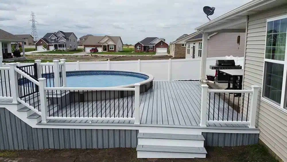 pool deck with deck railing and deck steps.